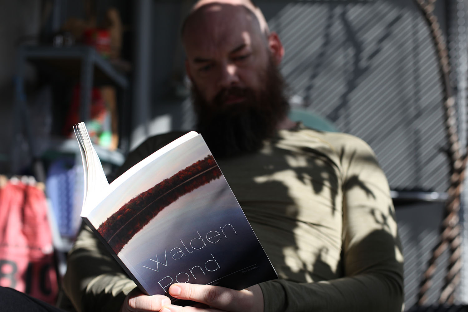 a copy of Walden Pond on a wooden table, with a pencil resting on top